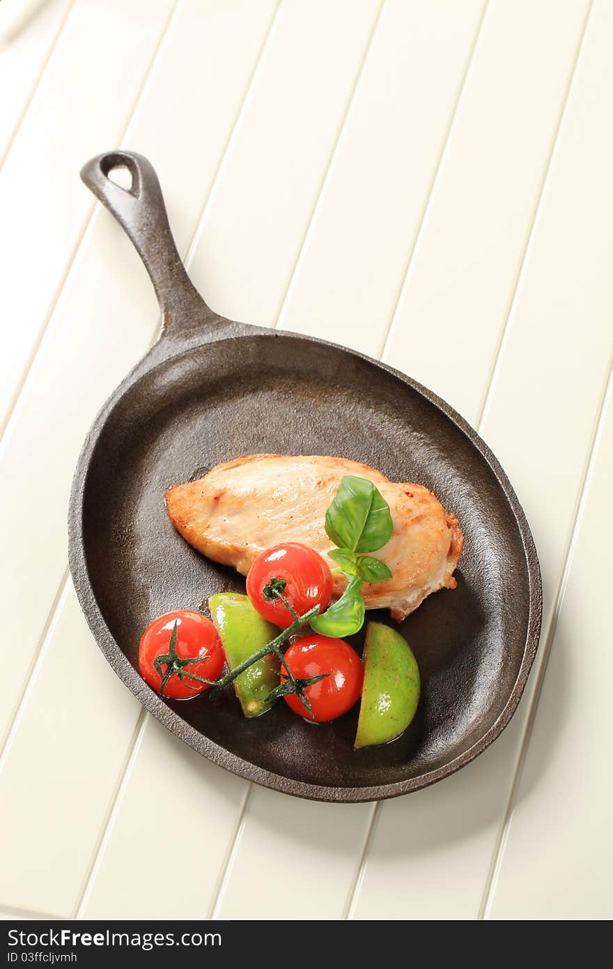 Pan roasted chicken breast on a skillet