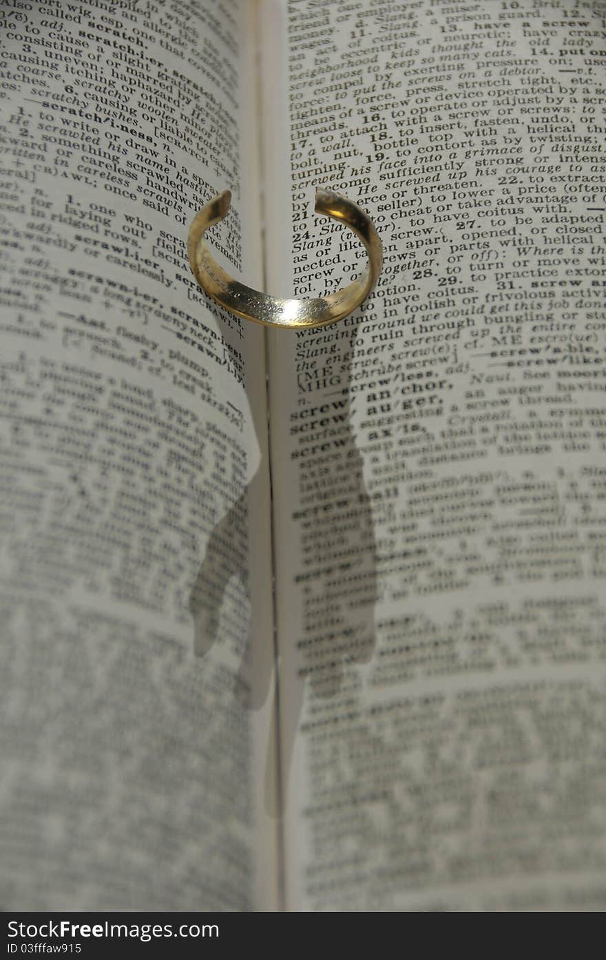 Ring in a book with  hand shadow