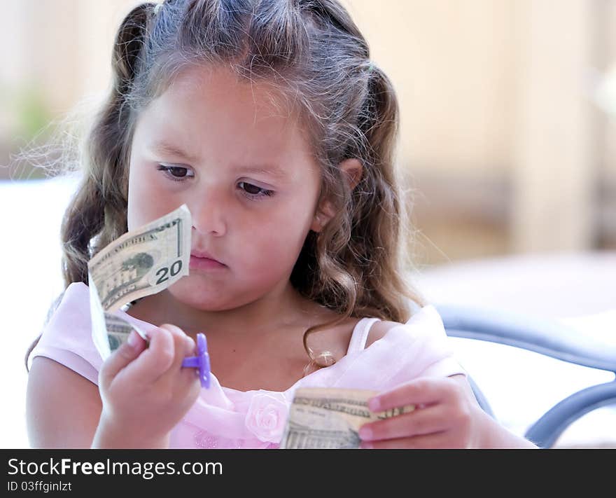 Child Looking at Money