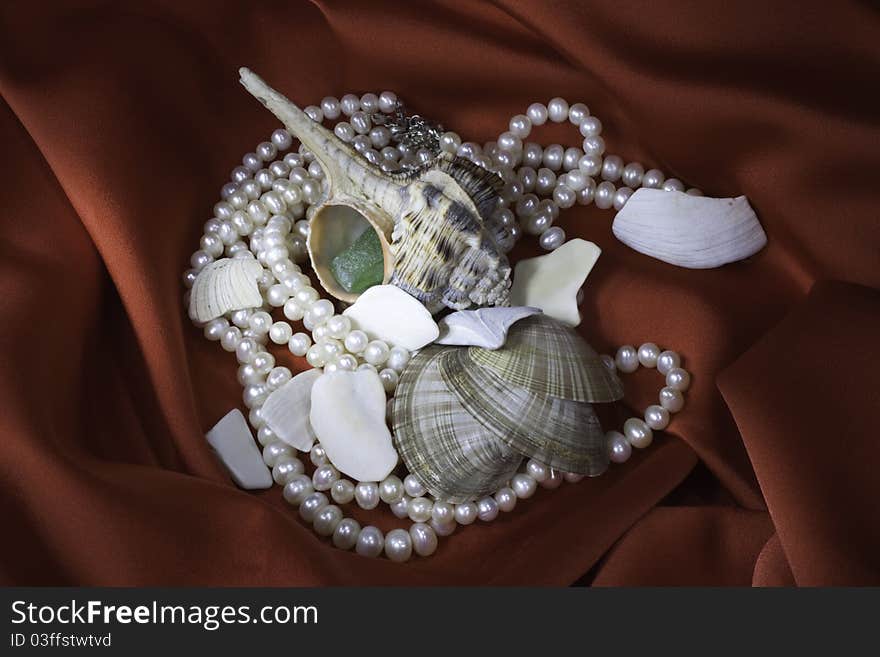 Cockleshells, a coral and pearls