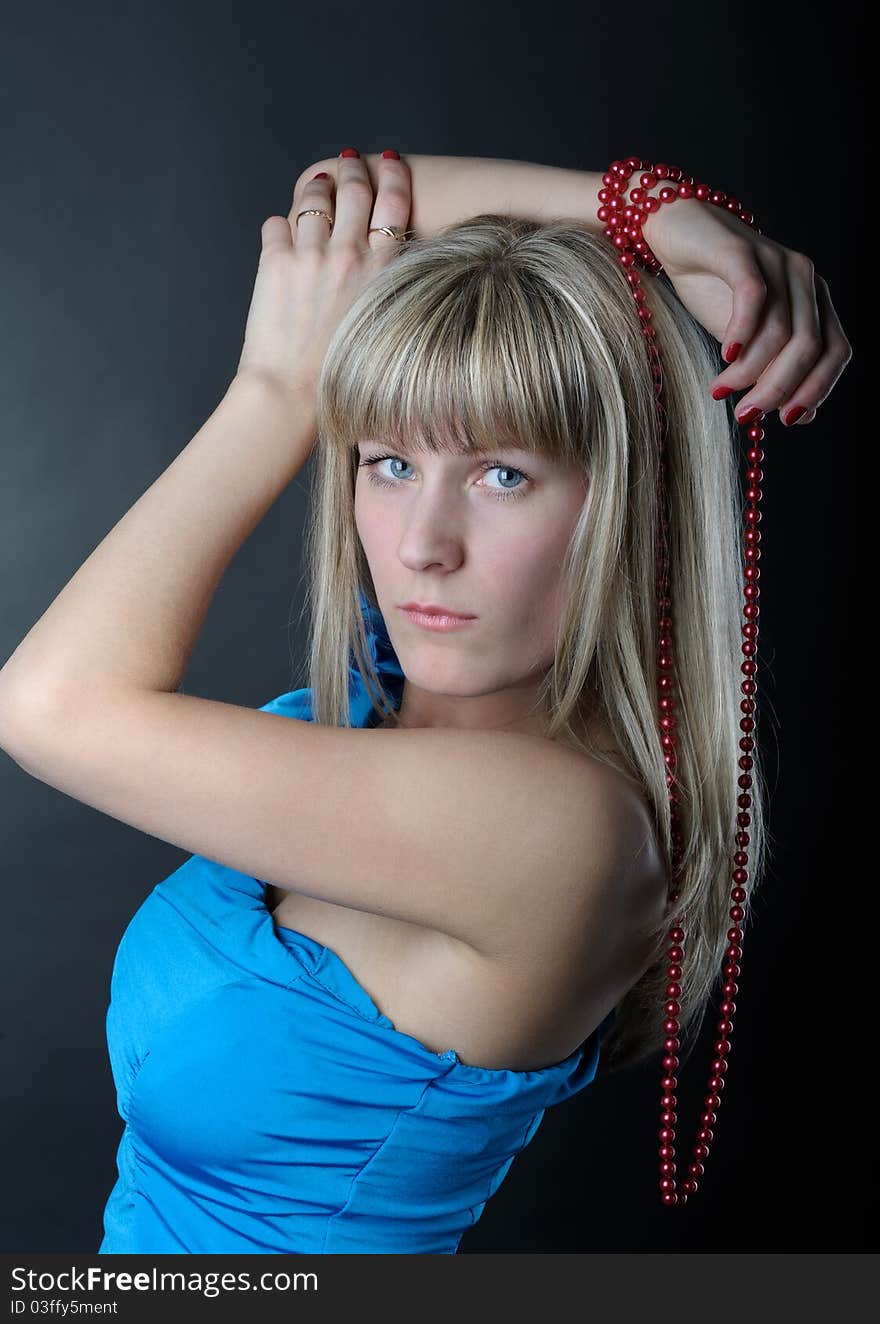 Woman in blue dress with beads