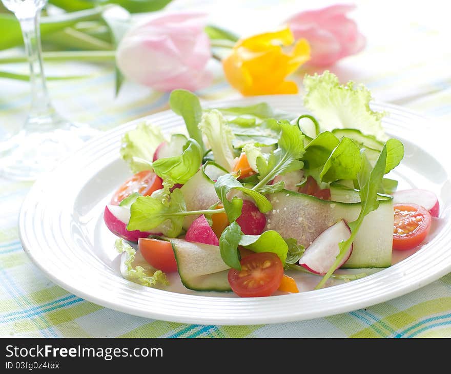 Fresh salad from raw vegetables and lettuce