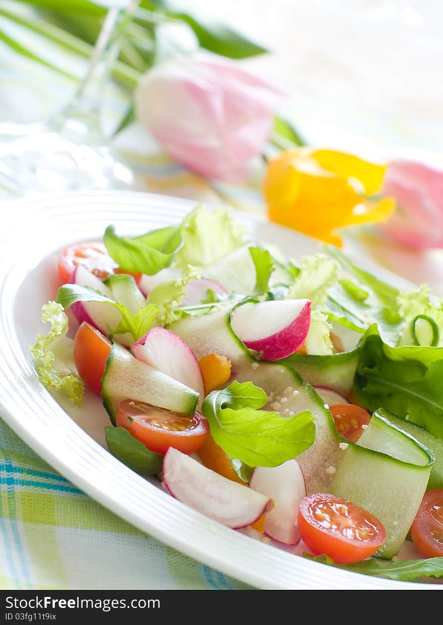 Fresh salad from raw vegetables and lettuce