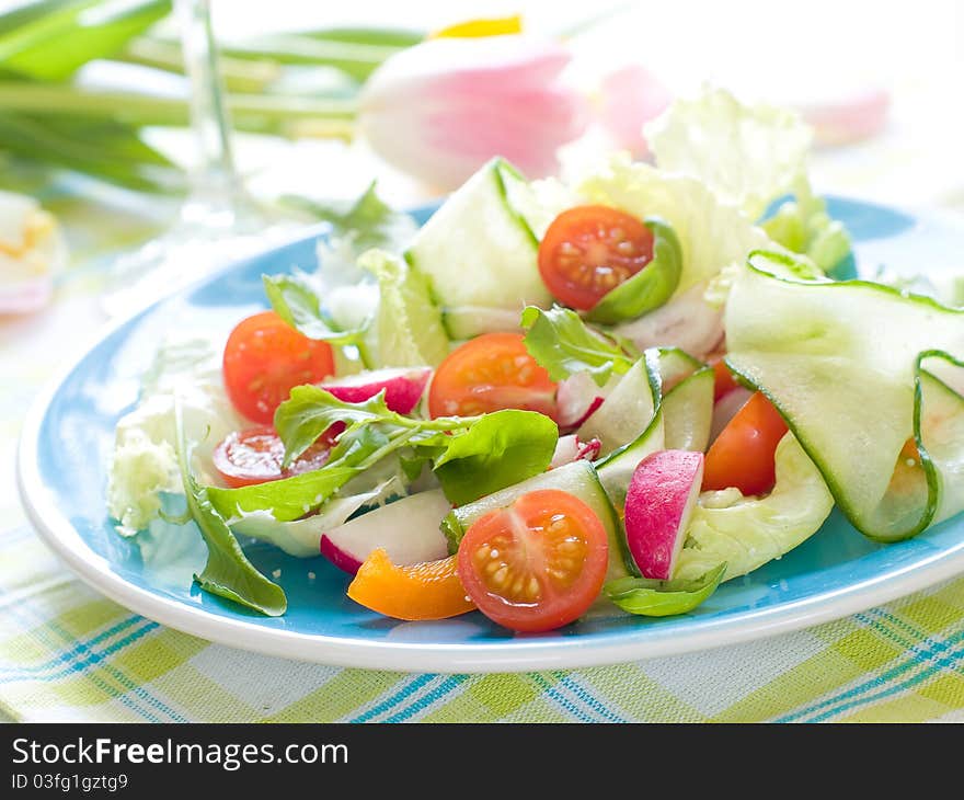 Fresh salad from raw vegetables and lettuce