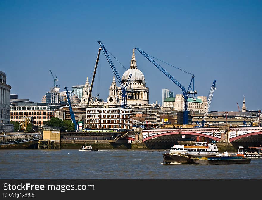 View of London with construction cranes.