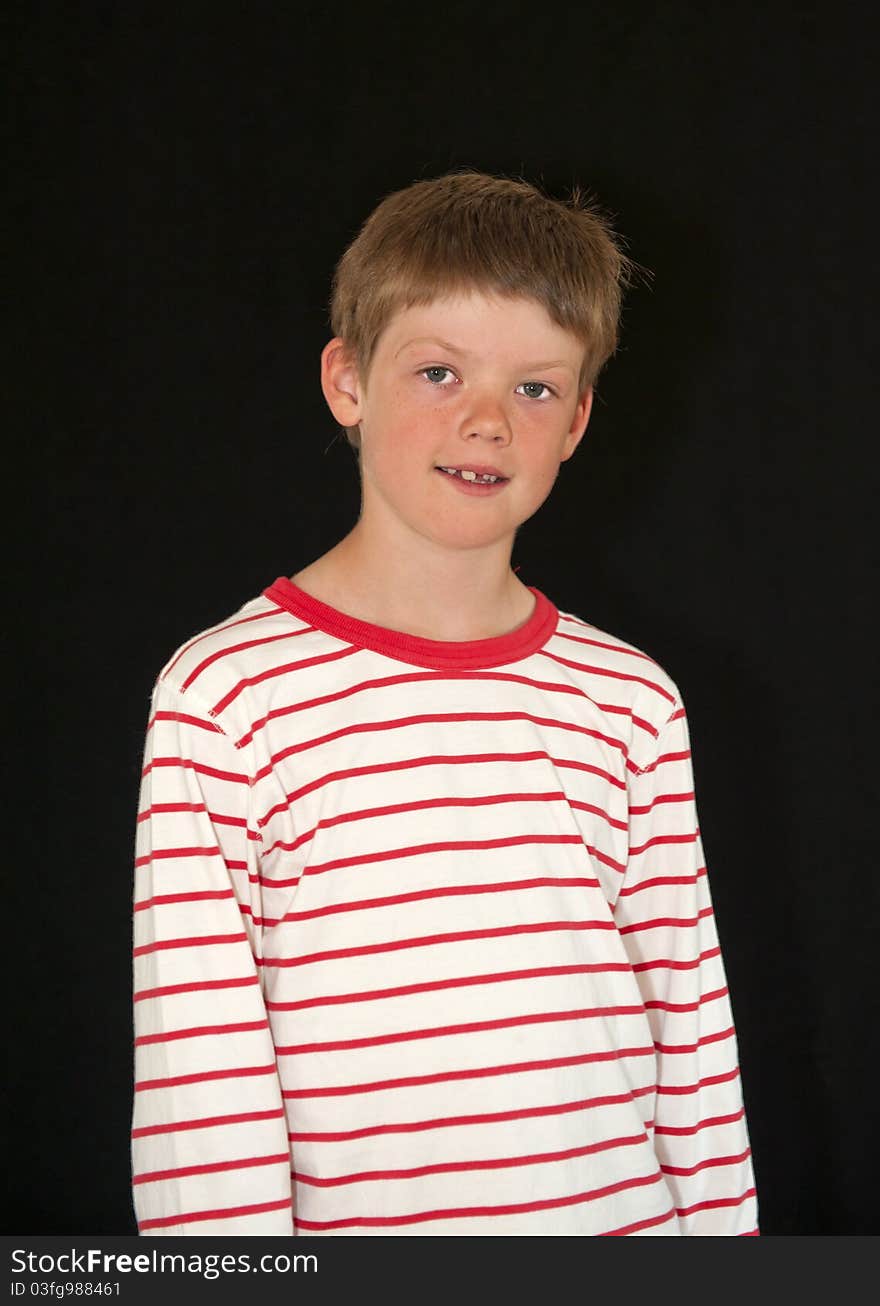 Adorable young boy isolated on a black background