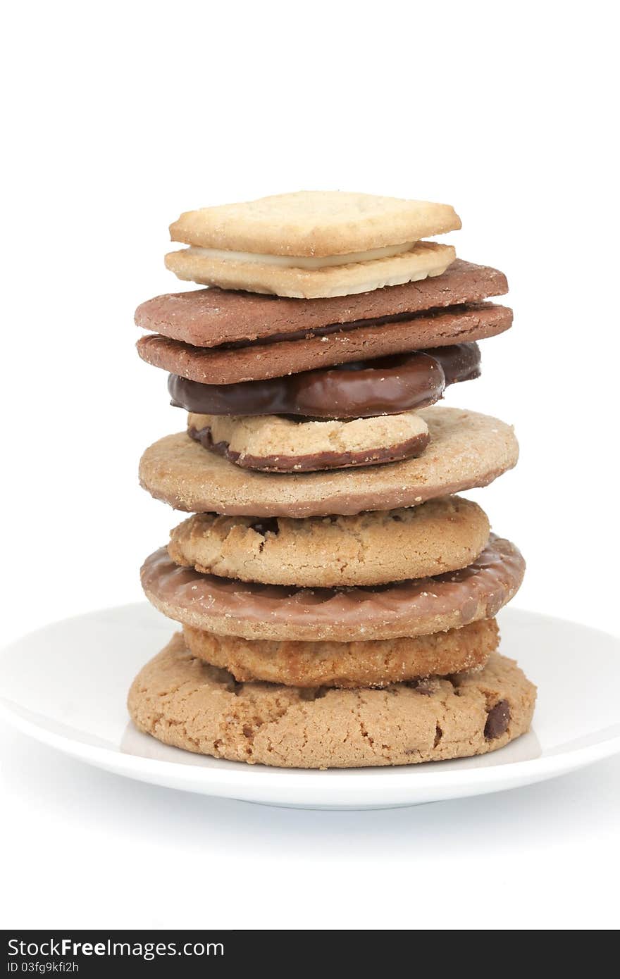 Tower of different types of biscuit on a white background. Tower of different types of biscuit on a white background