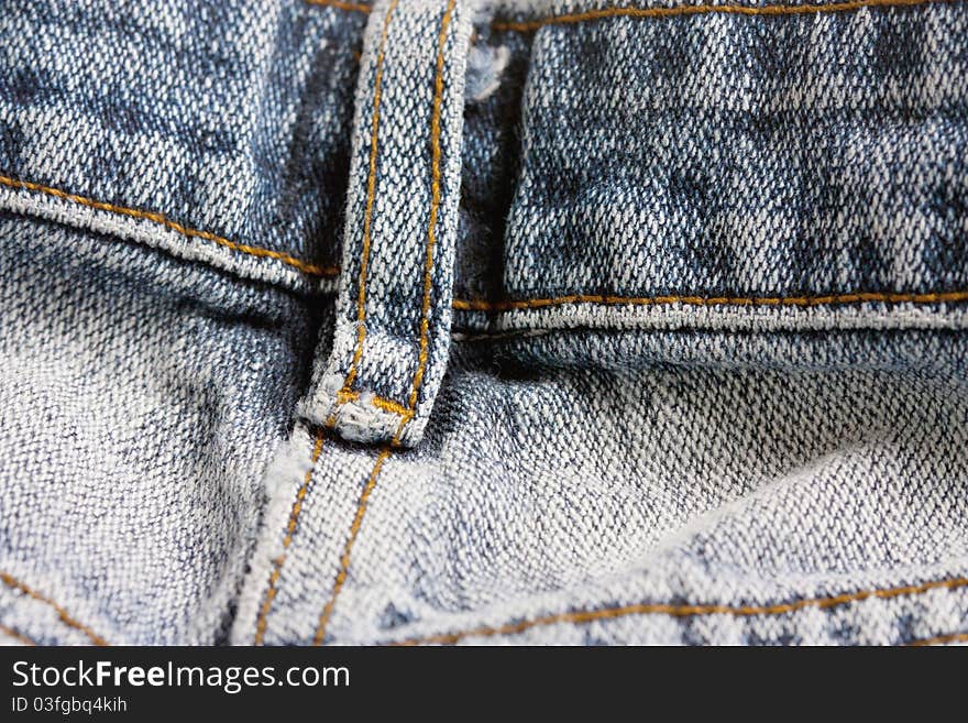 Macro studio shot of close up of jeans belt loop. Macro studio shot of close up of jeans belt loop