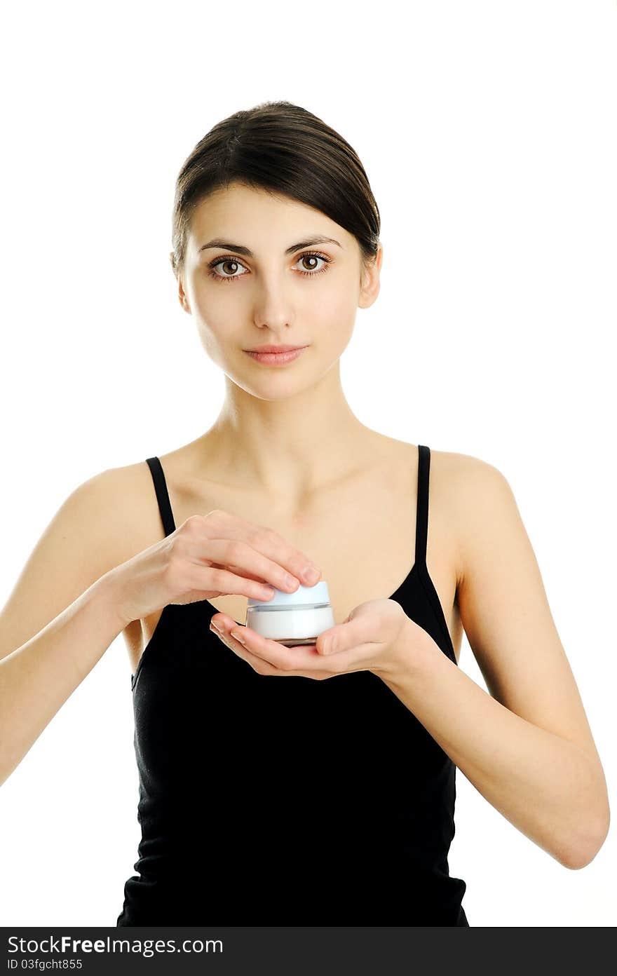 An image of a young woman with facial cream. An image of a young woman with facial cream