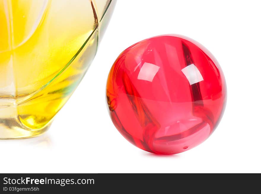 Colorful transparent perfume bottle over white background