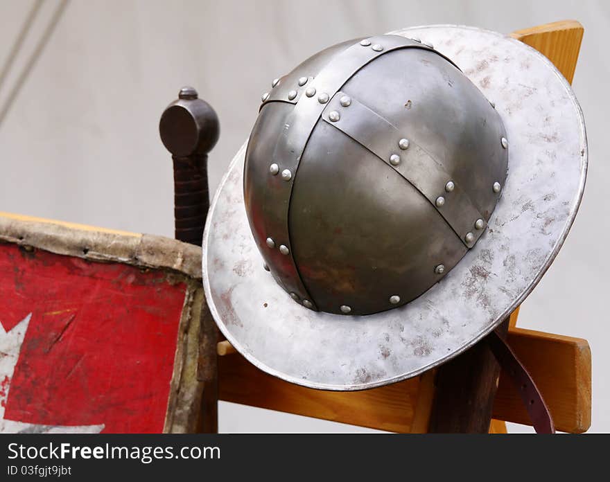 Iron helmet medieval knight and his sword