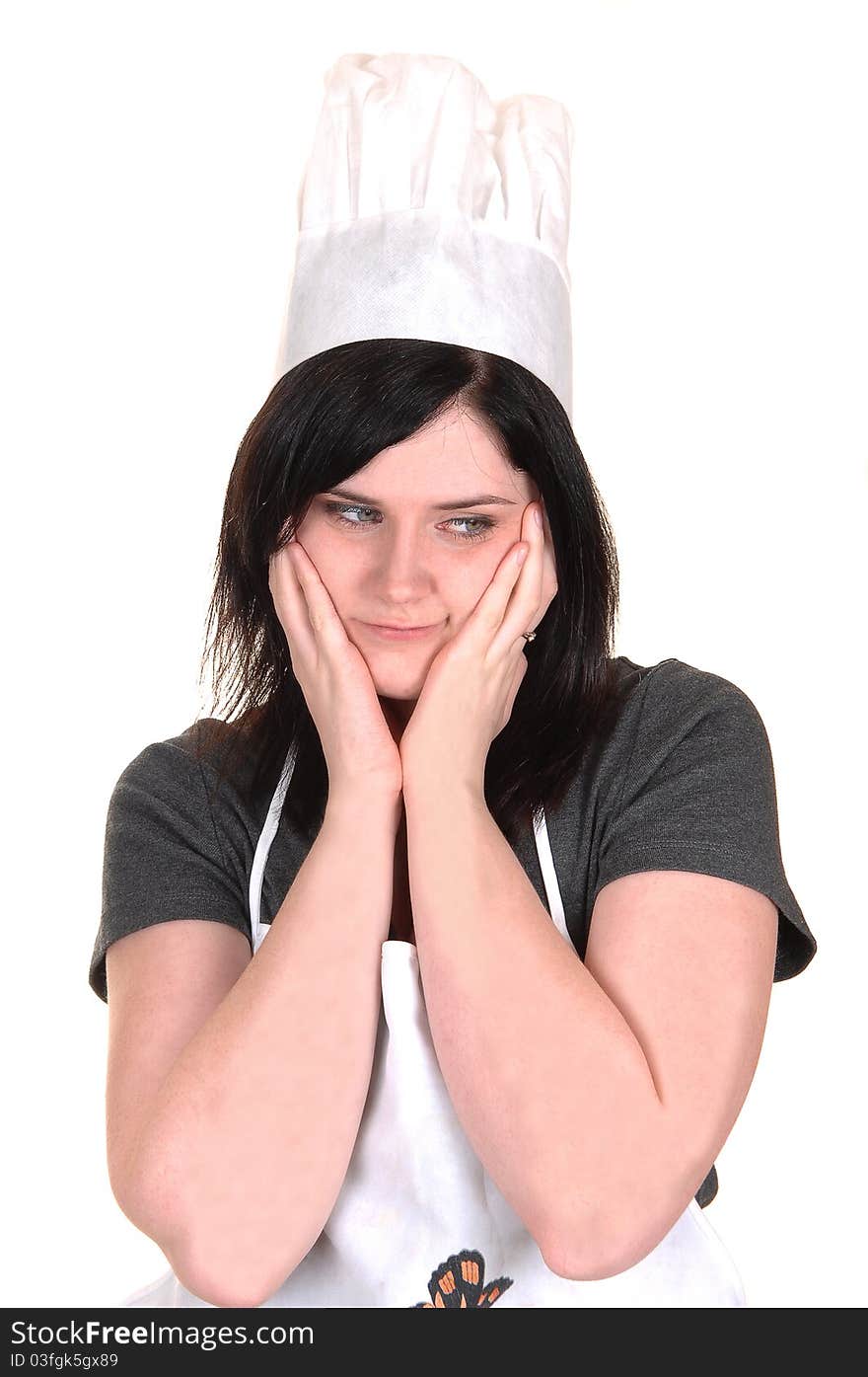 A lovely portrait of a young woman with an apron and cooking hat,
thinking, for white background. A lovely portrait of a young woman with an apron and cooking hat,
thinking, for white background.