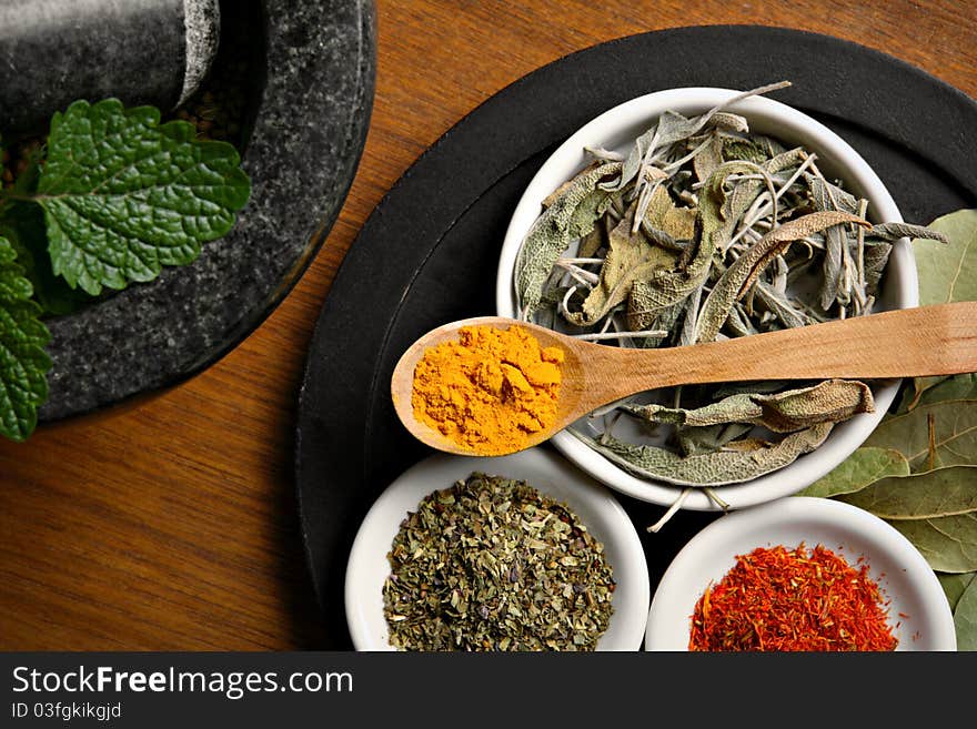 Different spices on wooden table