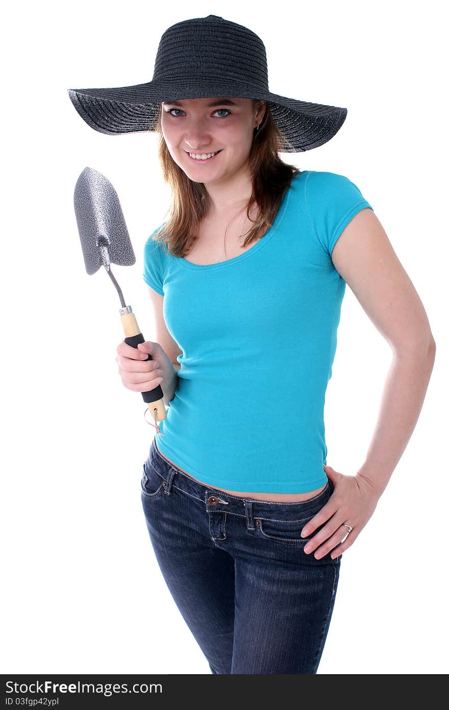 Woman holding a gardening shovel. Woman holding a gardening shovel