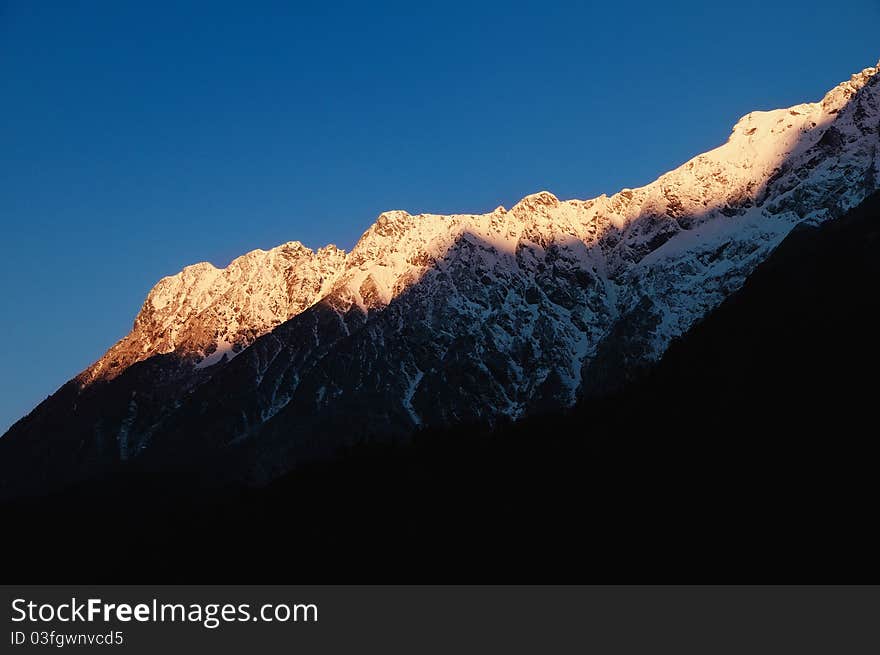 First rays of dawn falling on the snow-capped himalayan peaks. First rays of dawn falling on the snow-capped himalayan peaks