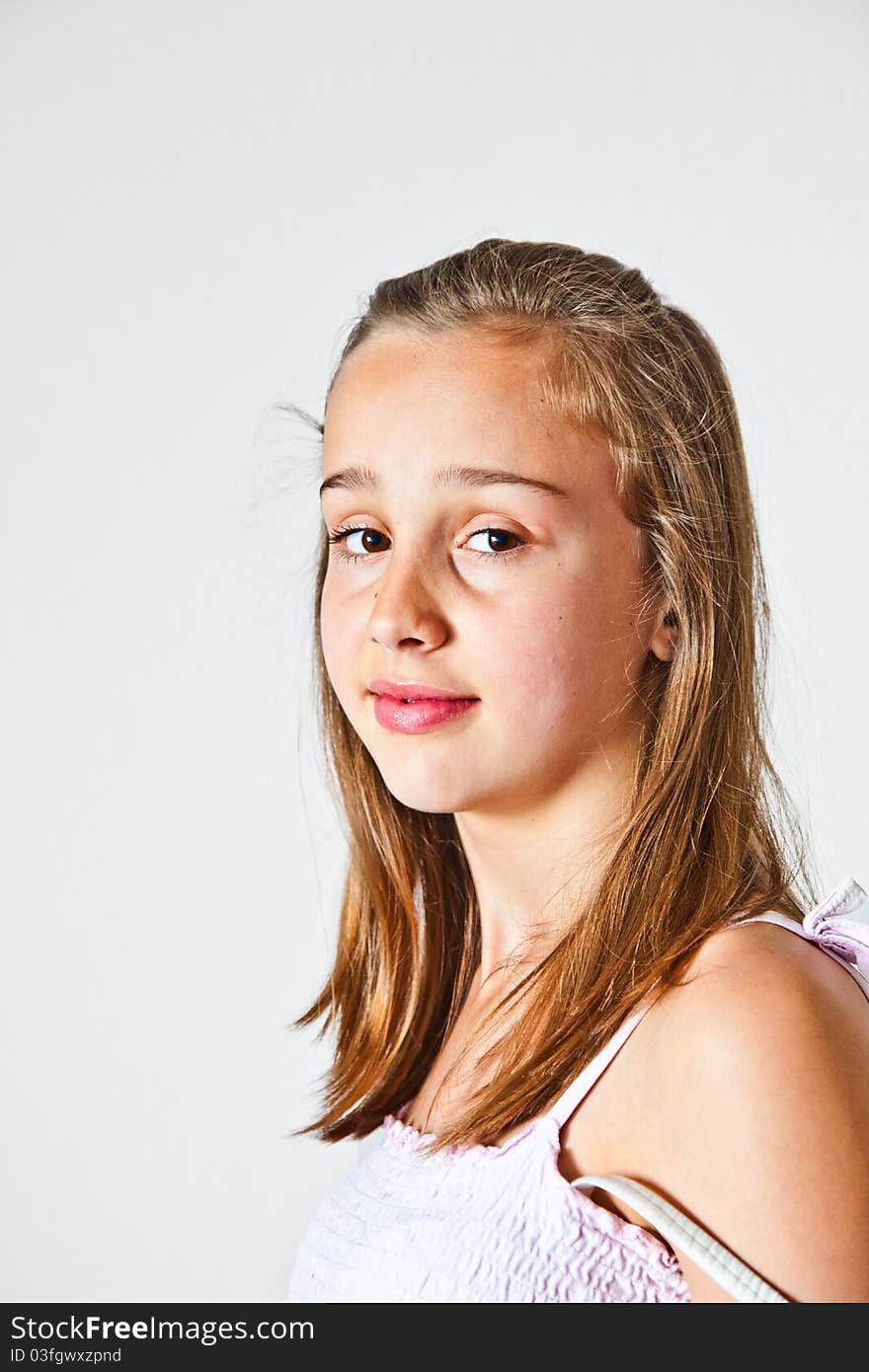 Portrait of cute young teenage girl in studio