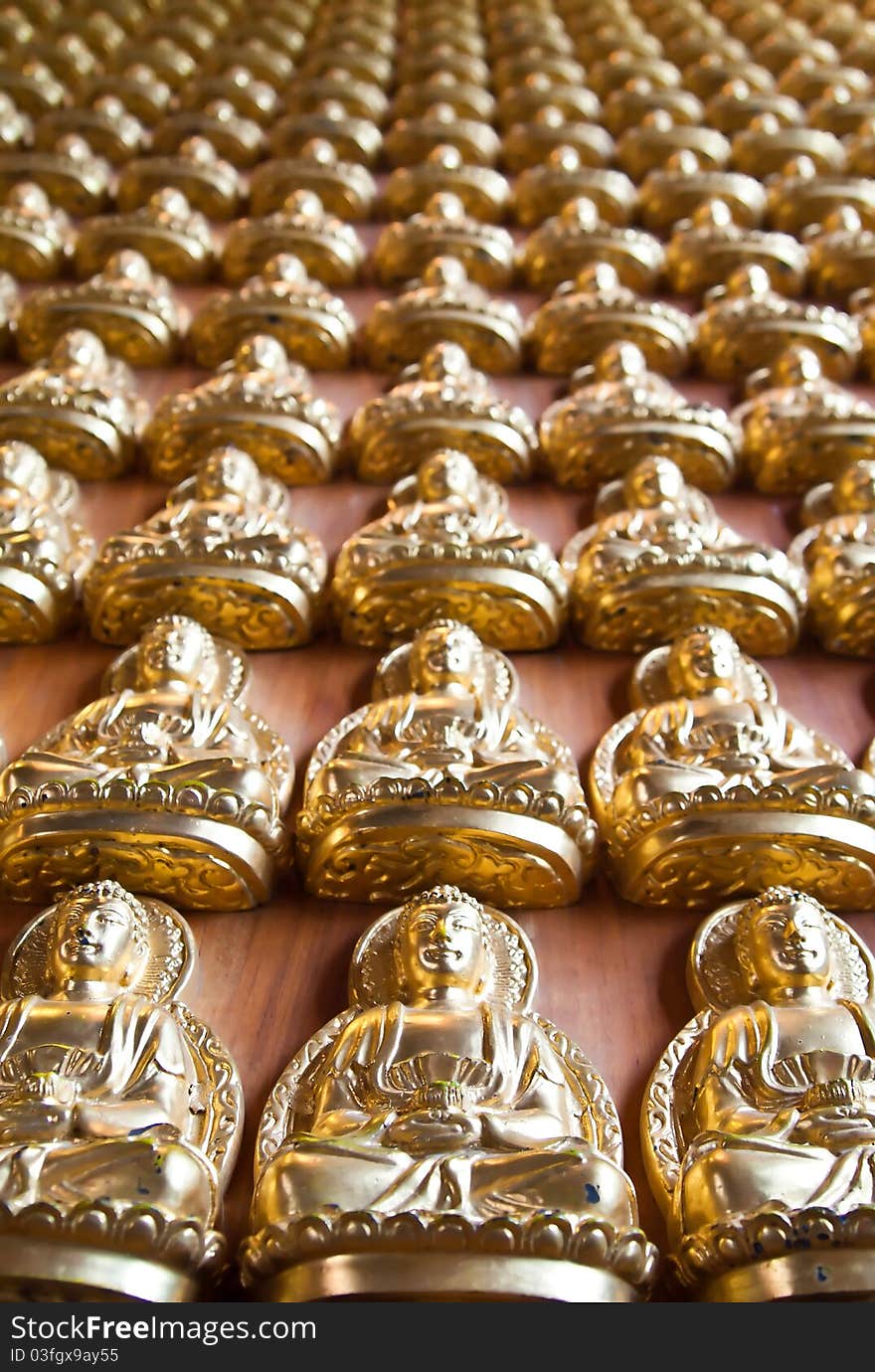 Many small Buddha statue on the wall at chinese temple in Thailand (Vertical). Many small Buddha statue on the wall at chinese temple in Thailand (Vertical)