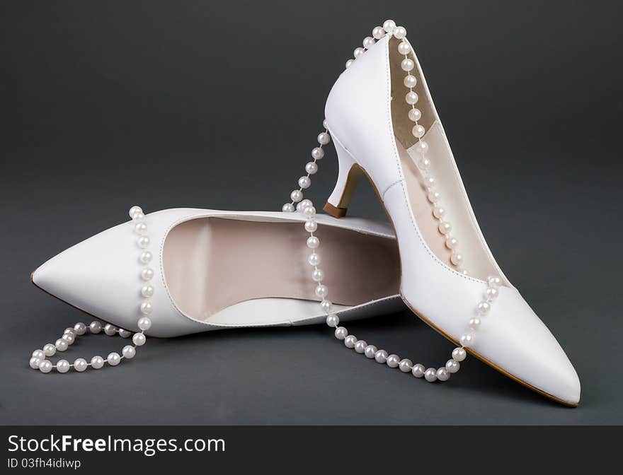 White wedding shoes with pearl. White wedding shoes with pearl