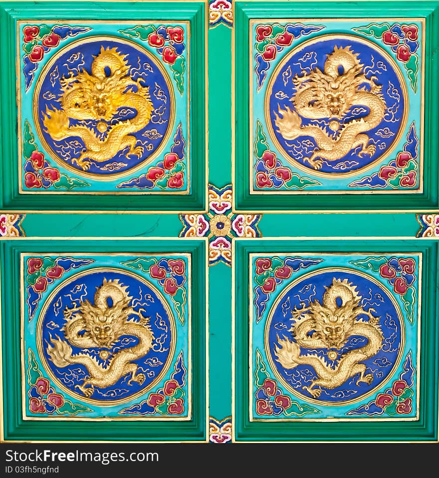 Wallpaper of Golden dragons sculpture at chinese temple in Thailand