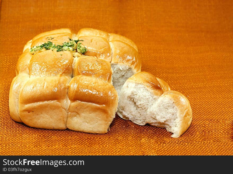 Garlic bread on an orange background