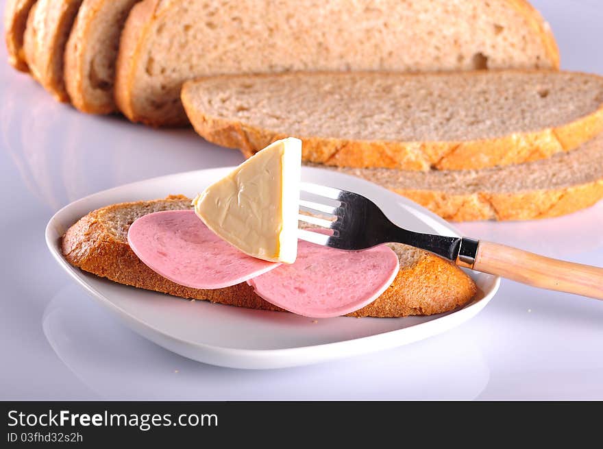 Loaf of sliced bread isolated on a white background. Loaf of sliced bread isolated on a white background