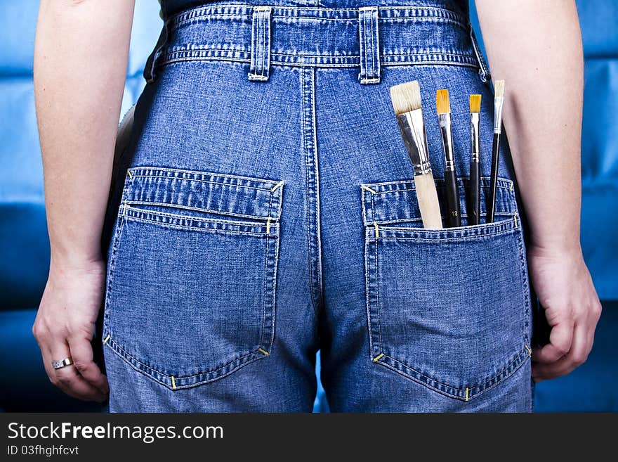 Jeans with paint brushes