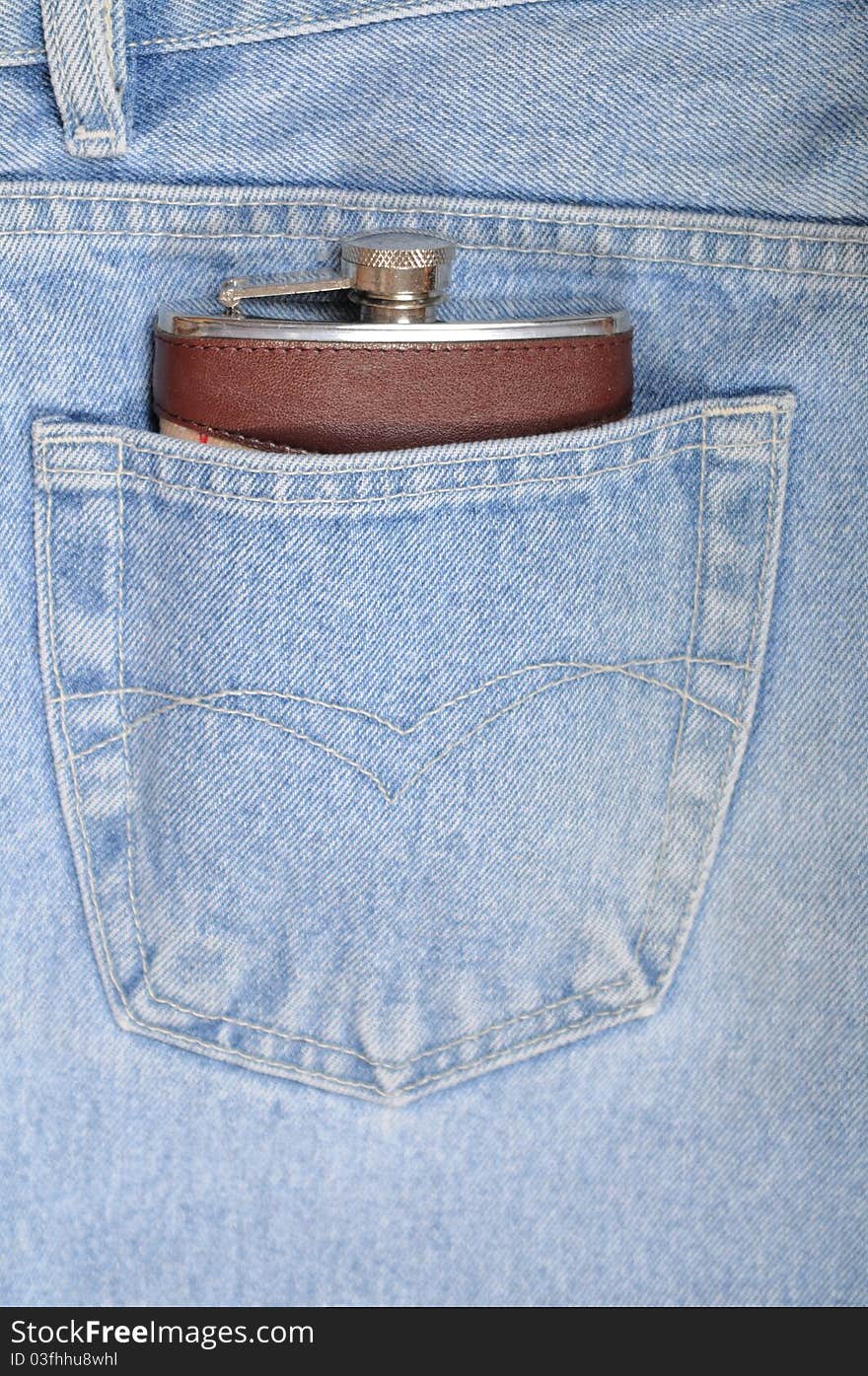 Flask close up in a hip-pocket of jeans