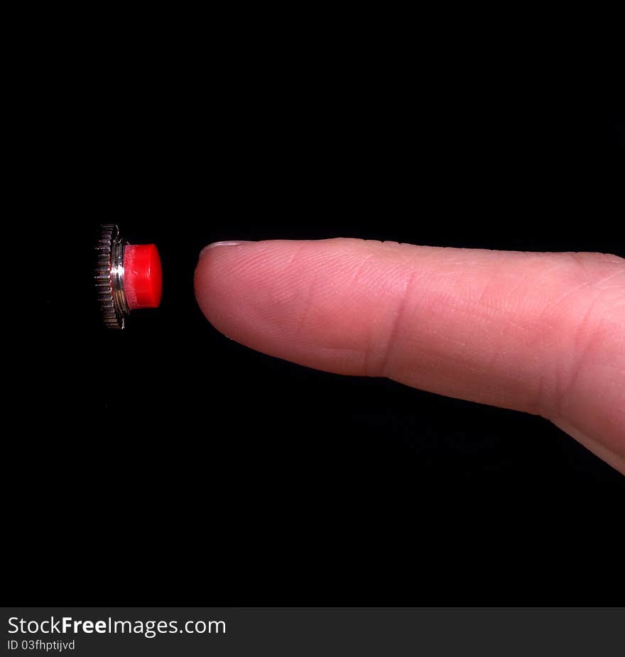 Finger about to push a red button. Finger about to push a red button