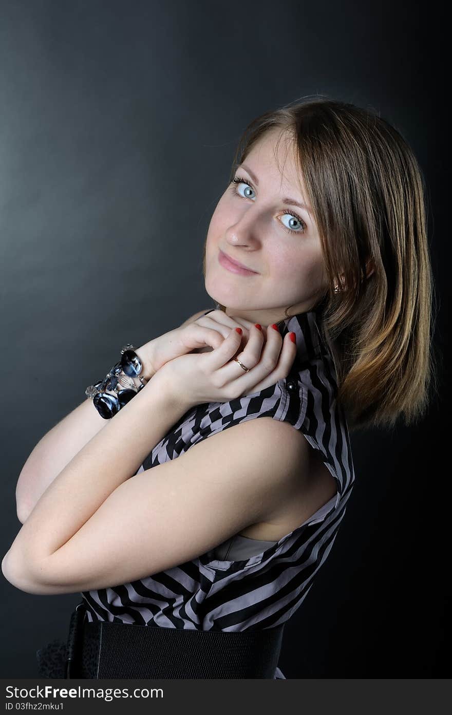 Slim girl in studio on black background