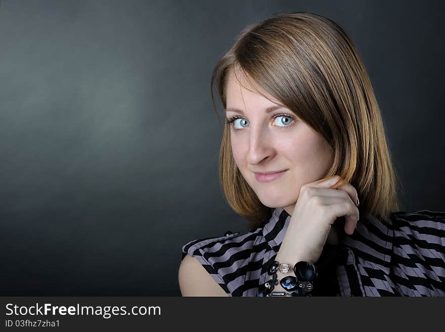 Slim girl in studio on black background