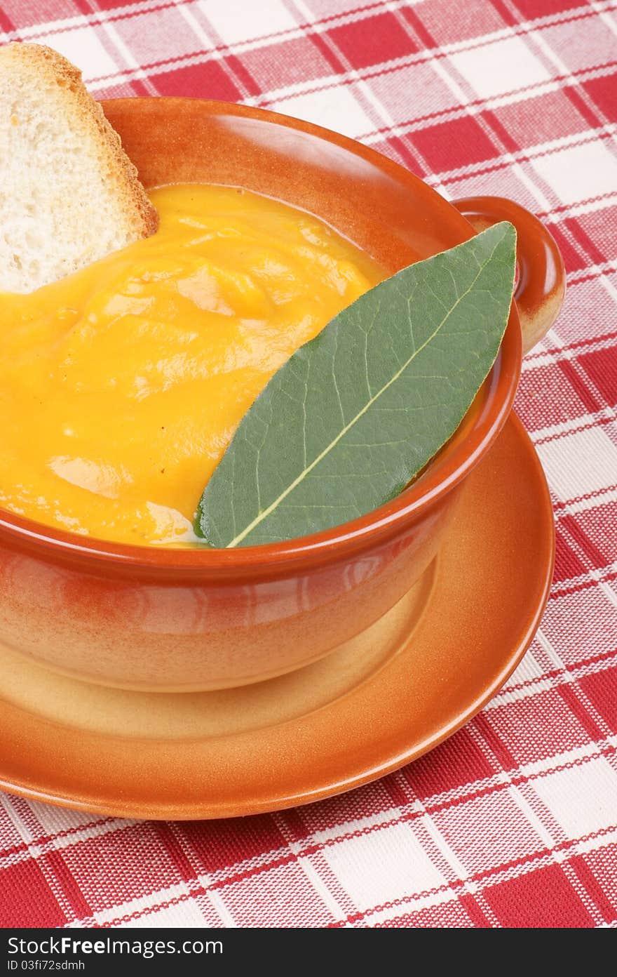 Cream of squash soup in a casserole pot