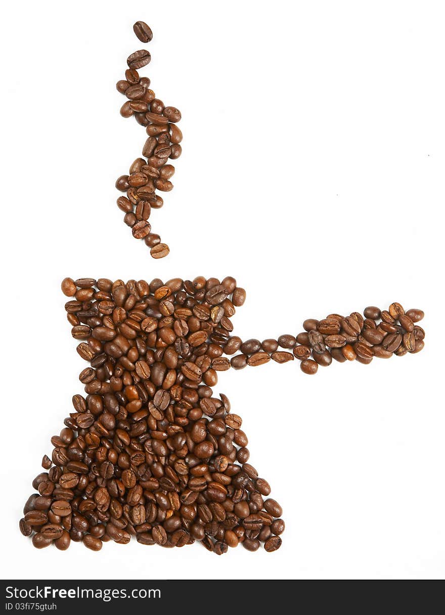 Mug shape made from coffee beans on white background