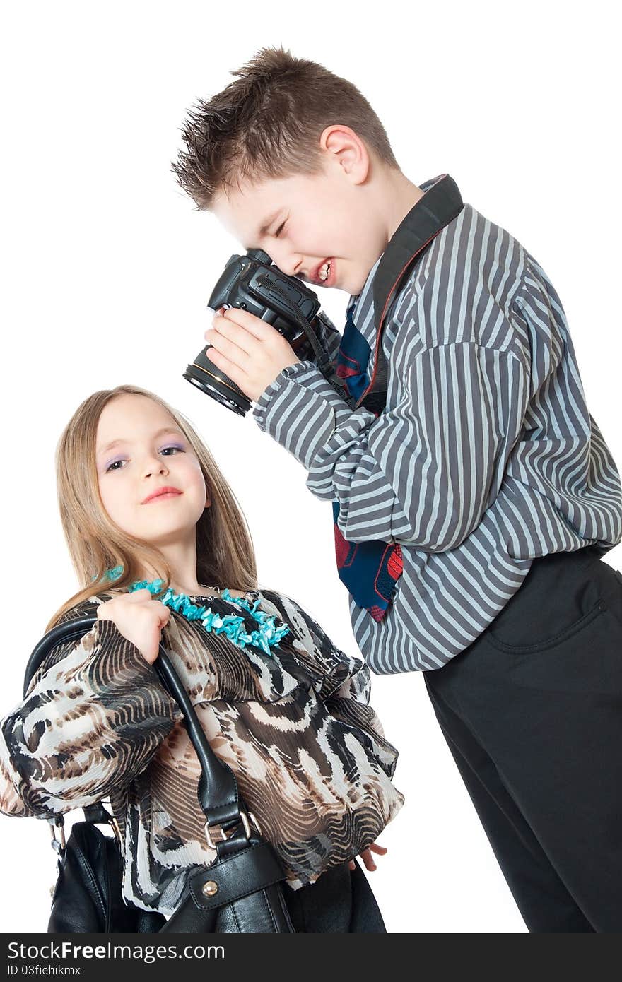 Children with a camera isolated on white. Children with a camera isolated on white