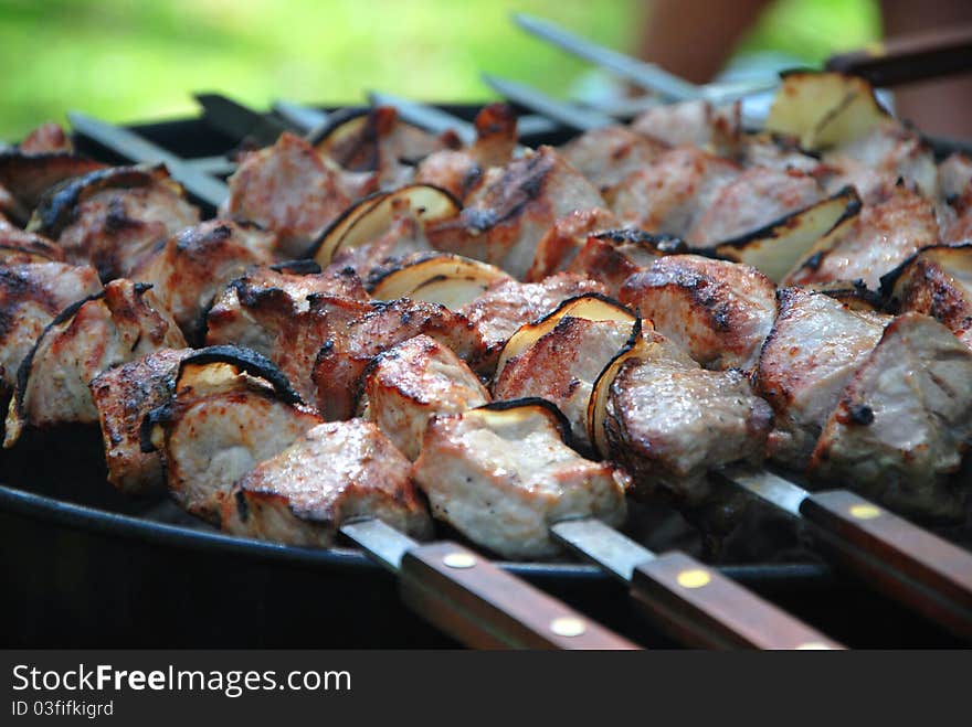 Juicy slices of meat barbecue shashlik with sauce prepare on fire. Juicy slices of meat barbecue shashlik with sauce prepare on fire