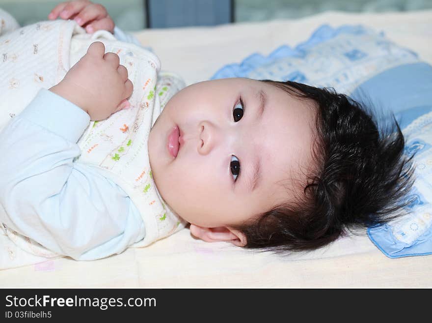 Cute baby wakeup in his bed. Cute baby wakeup in his bed