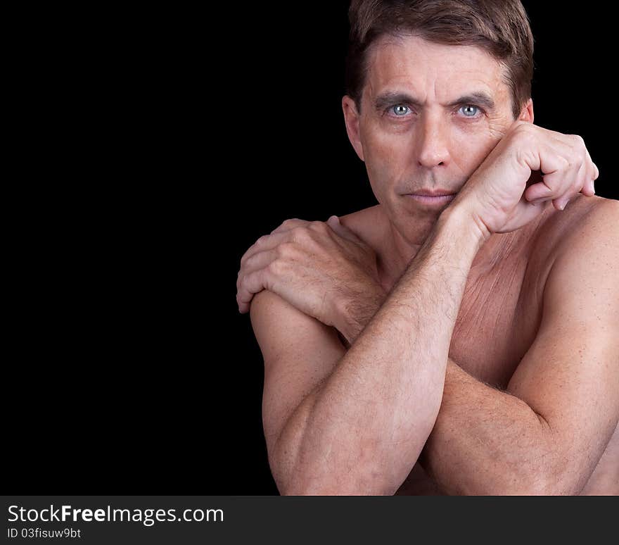 Nice portrait of a handsome shirtless man in a pensive pose. Nice portrait of a handsome shirtless man in a pensive pose.