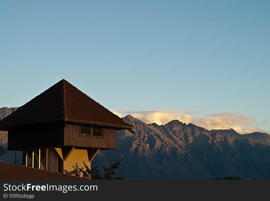 Wooden house on rooftop with Mountain in the background queenstown new zealand