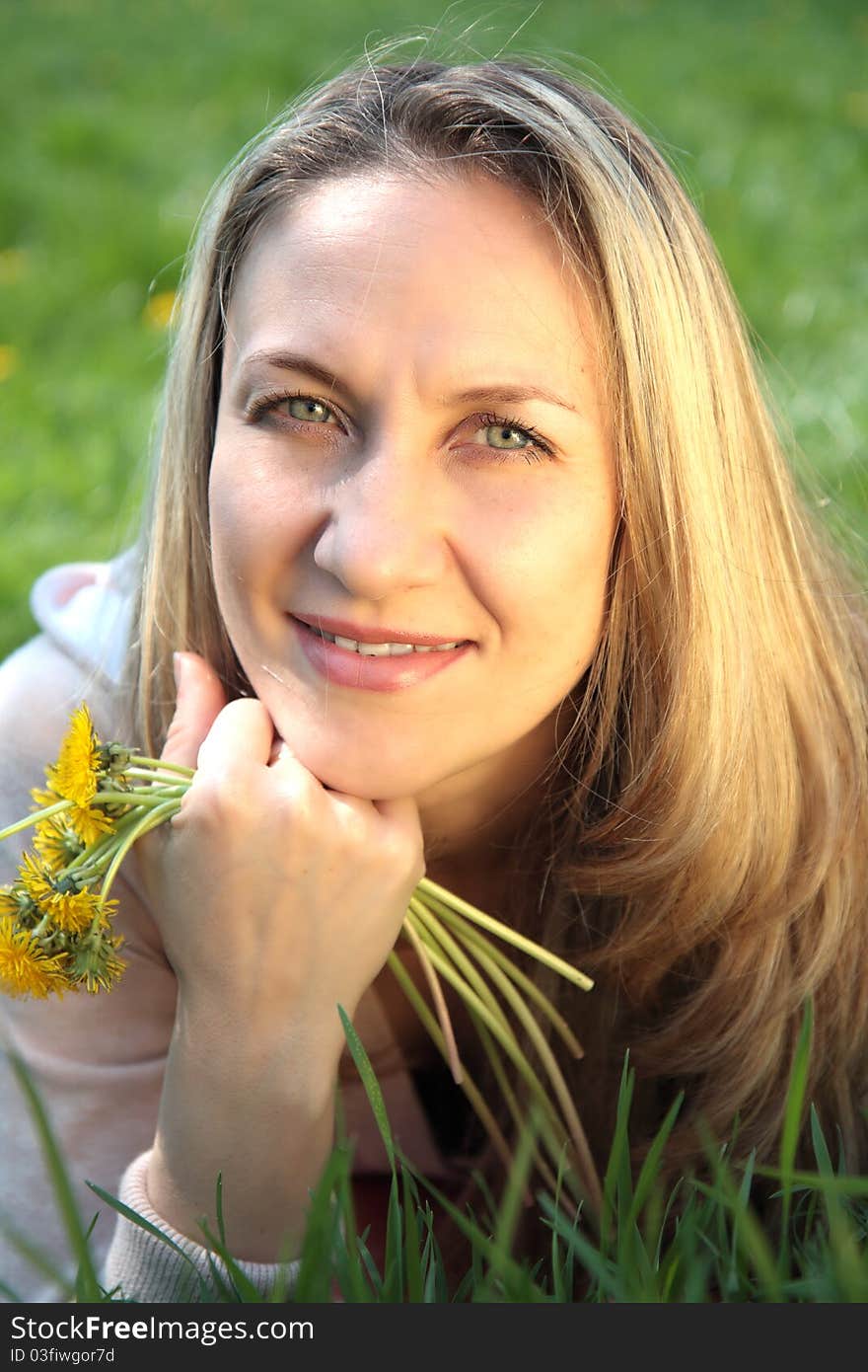 Young beautiful woman in  field