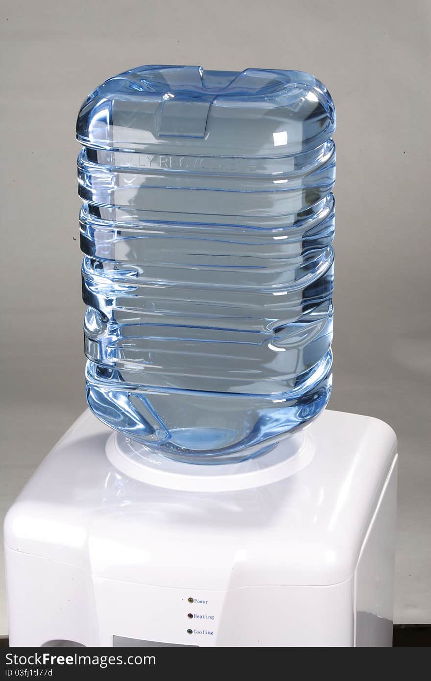 Large bottle of water on a silver background