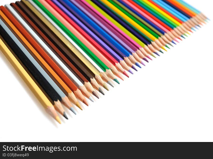 Many colorful school pencils isolated on white background