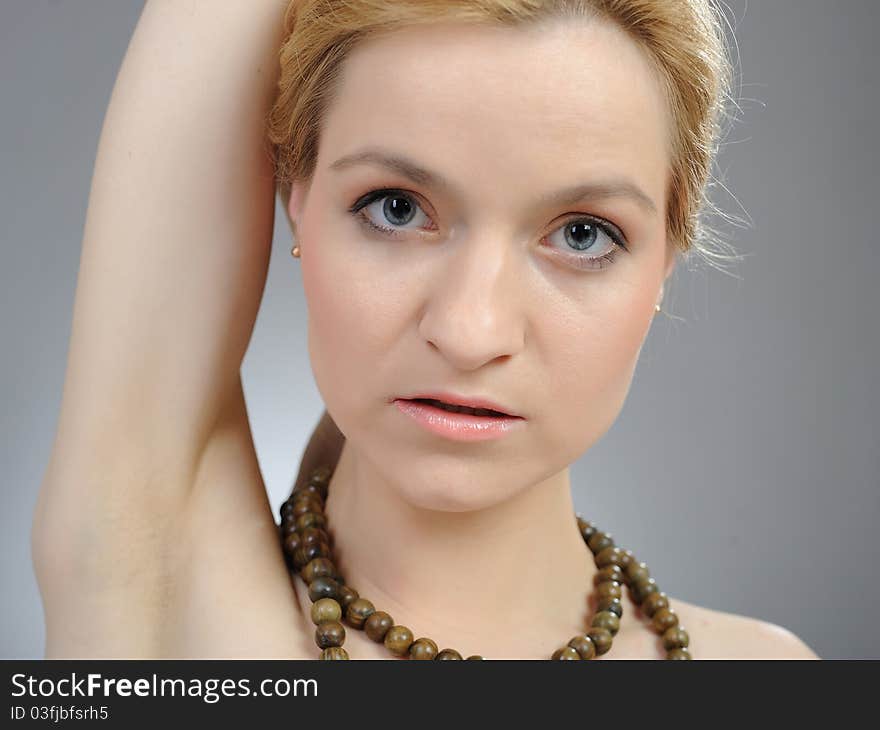 Pretty womans face with pure healthy skin and indian mala