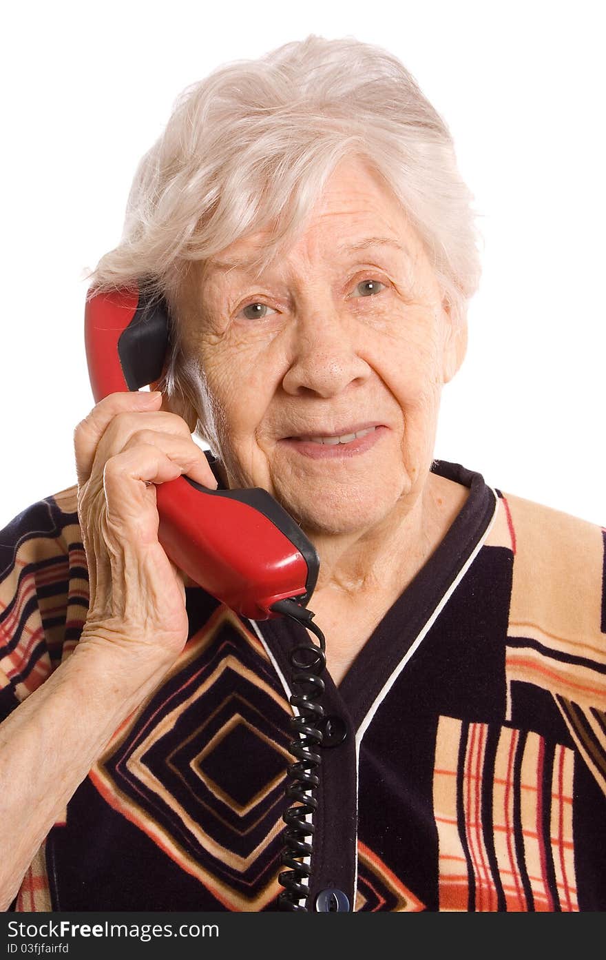 The elderly woman speaks on the phone