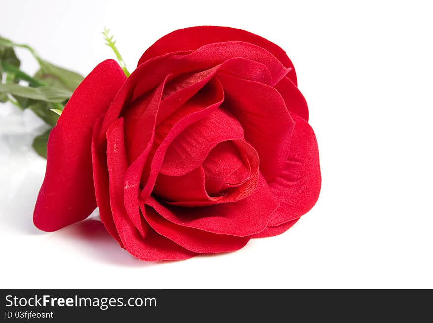 Close up fabric red rose flower on isolated white. Close up fabric red rose flower on isolated white