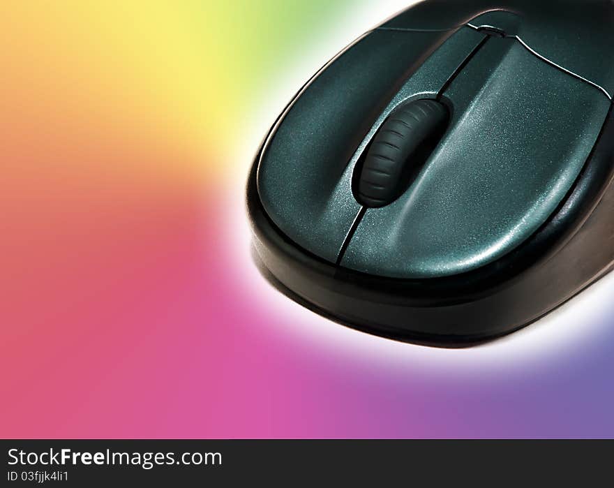 Wireless mouse on a colourful background