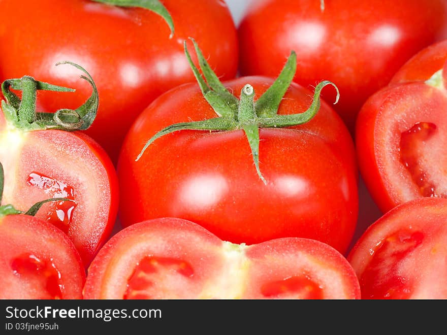 Many fresh red tomatoes background