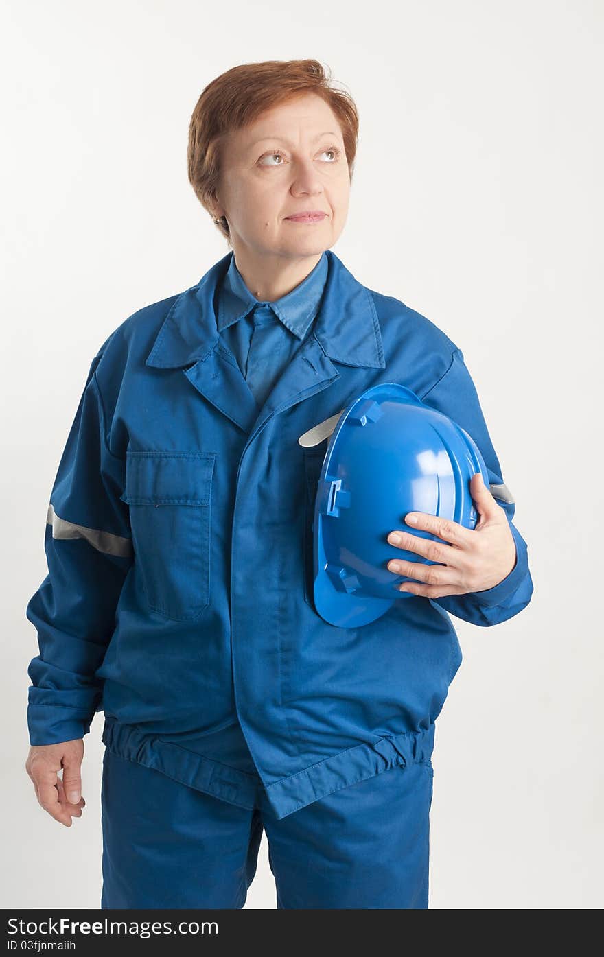 Adult woman holding a blue helmet. Adult woman holding a blue helmet