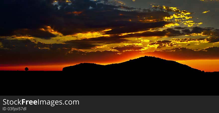 Evening sky with the sunset behind the mountain. Evening sky with the sunset behind the mountain.