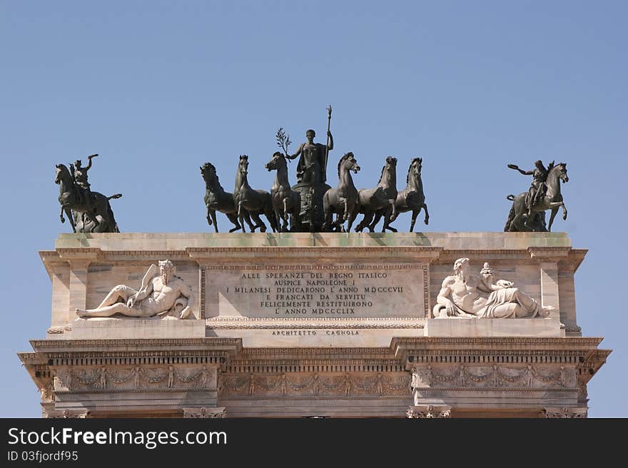 Top of the Arch of Peace (Arco della Pace) in Milan. It is a neoclassical triumph arch, 25 m high and 24 m wide, built between 1807 and 1838. The gate was the scene of several prominent events in the Milanese history of the 19th century. Top of the Arch of Peace (Arco della Pace) in Milan. It is a neoclassical triumph arch, 25 m high and 24 m wide, built between 1807 and 1838. The gate was the scene of several prominent events in the Milanese history of the 19th century