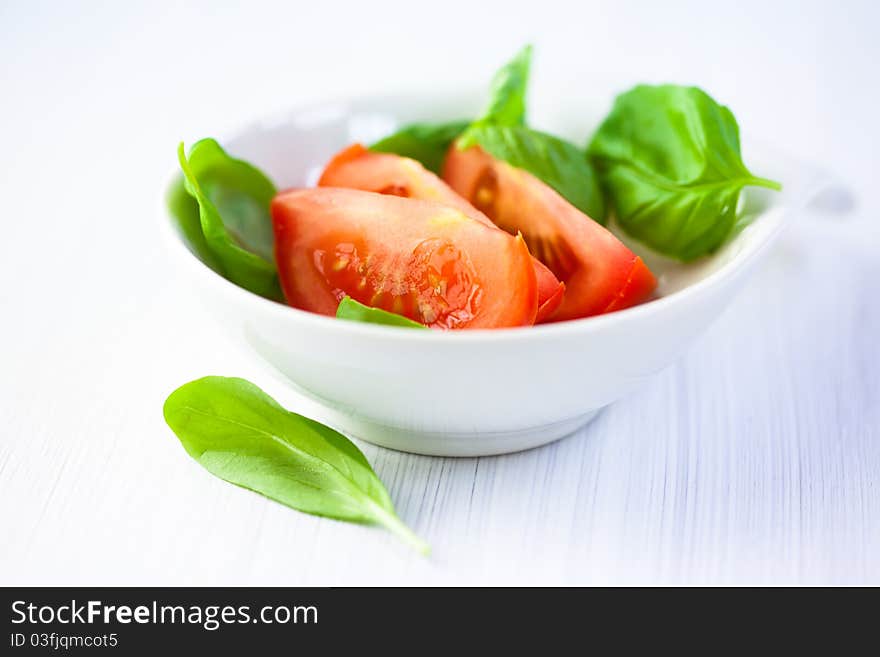 Fresh tomato and basil leaves for salad