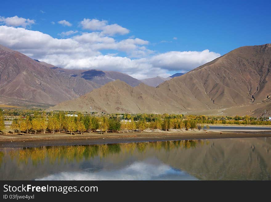 There is a beautiful small lake to one side of the road just a few kilometres away Lhasa city. There is a beautiful small lake to one side of the road just a few kilometres away Lhasa city